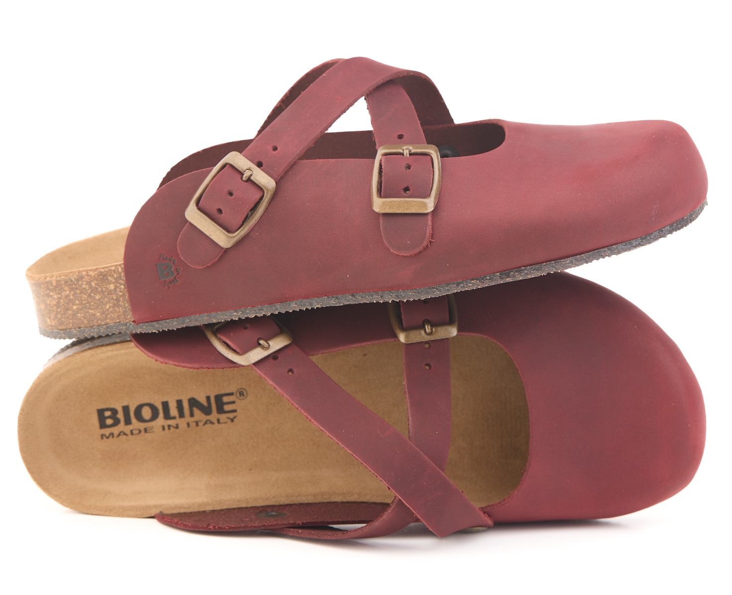 Wine-red leather crisscross strap clogs with cork footbed and buckle.